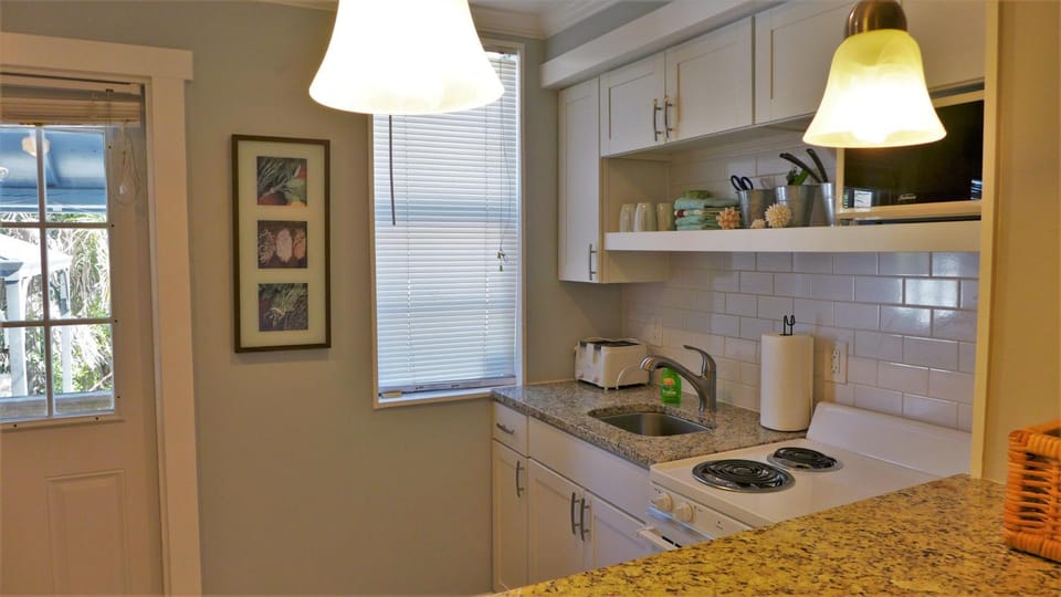 Kitchen or kitchenette, stove, toaster