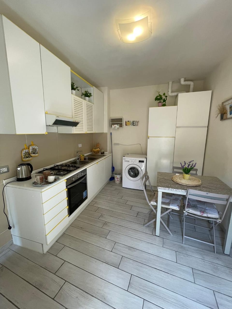 Kitchen or kitchenette, Dining area, oven, stove, washing machine, dryer