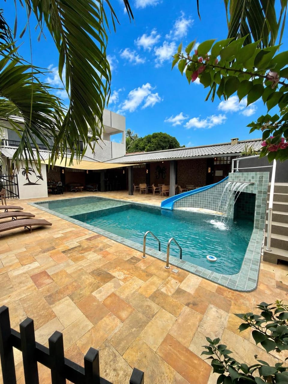 Property building, Day, Pool view, Swimming pool, sunbed