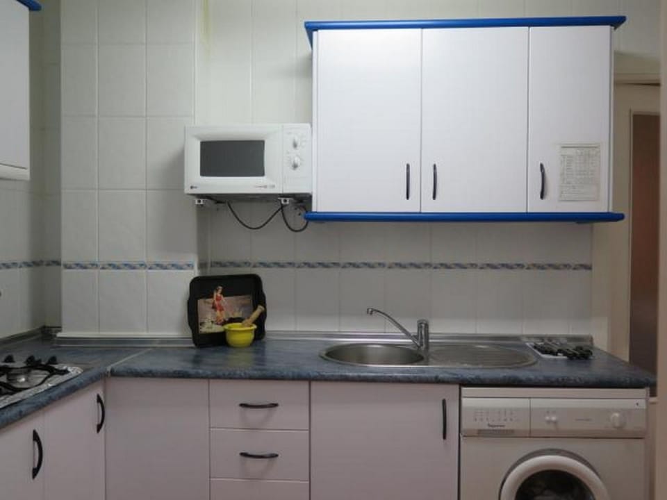 Kitchen or kitchenette, washing machine