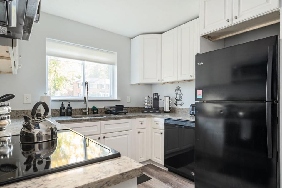 Kitchen or kitchenette, dishwasher, oven, stove, toaster