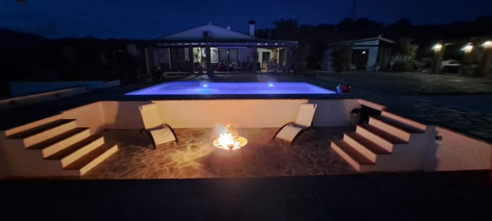 Patio, Night, Pool view, Swimming pool, sunbed