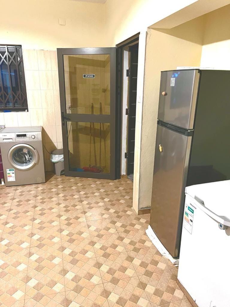 Kitchen or kitchenette, washing machine