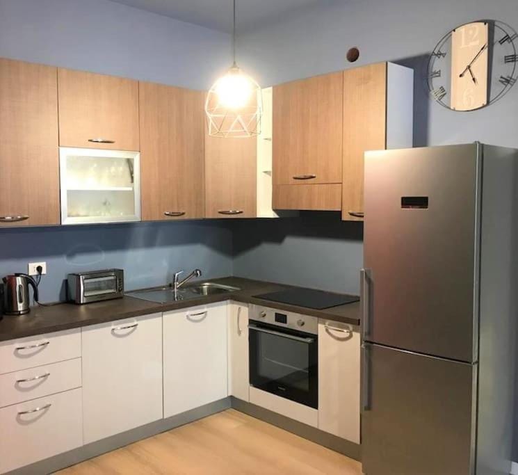 Kitchen or kitchenette, dishwasher, oven, stove, toaster