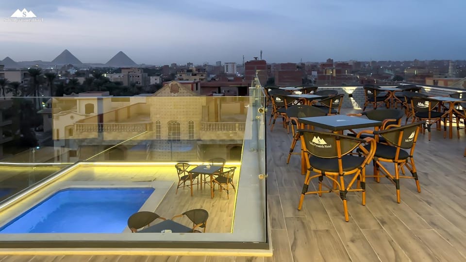 View (from property/room), Dining area, Pool view, Swimming pool