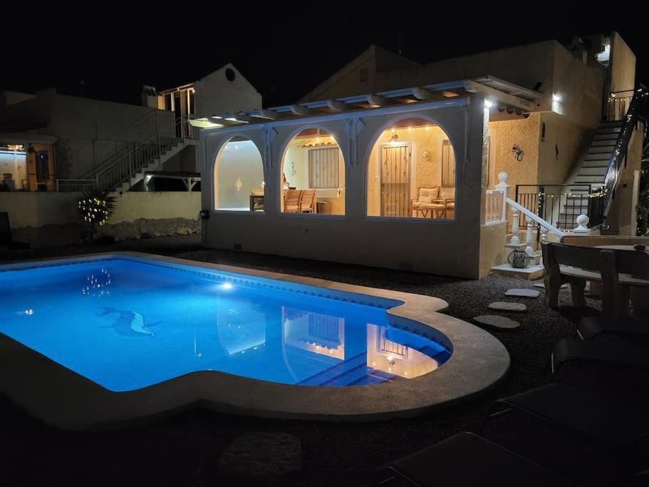 Property building, Patio, Night, Pool view, Swimming pool
