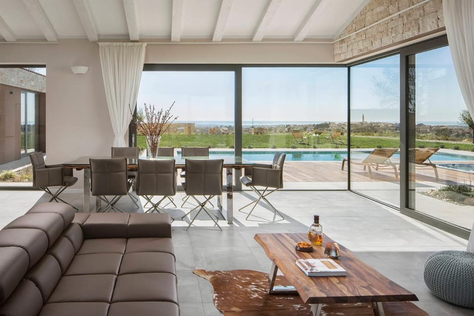 View (from property/room), Living room, Seating area, Pool view, Swimming pool