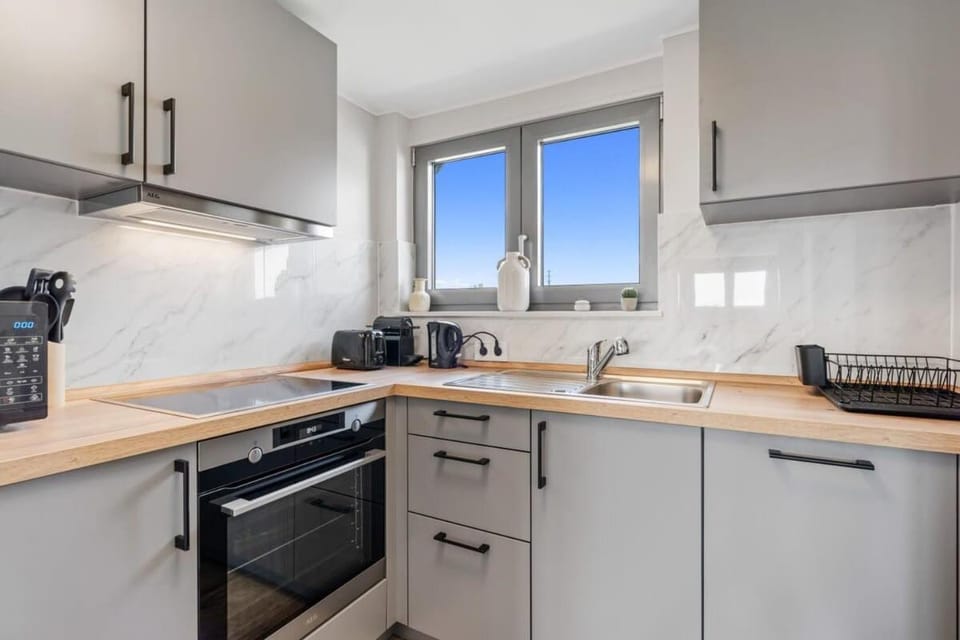 Kitchen or kitchenette, dishwasher, oven, stove, toaster