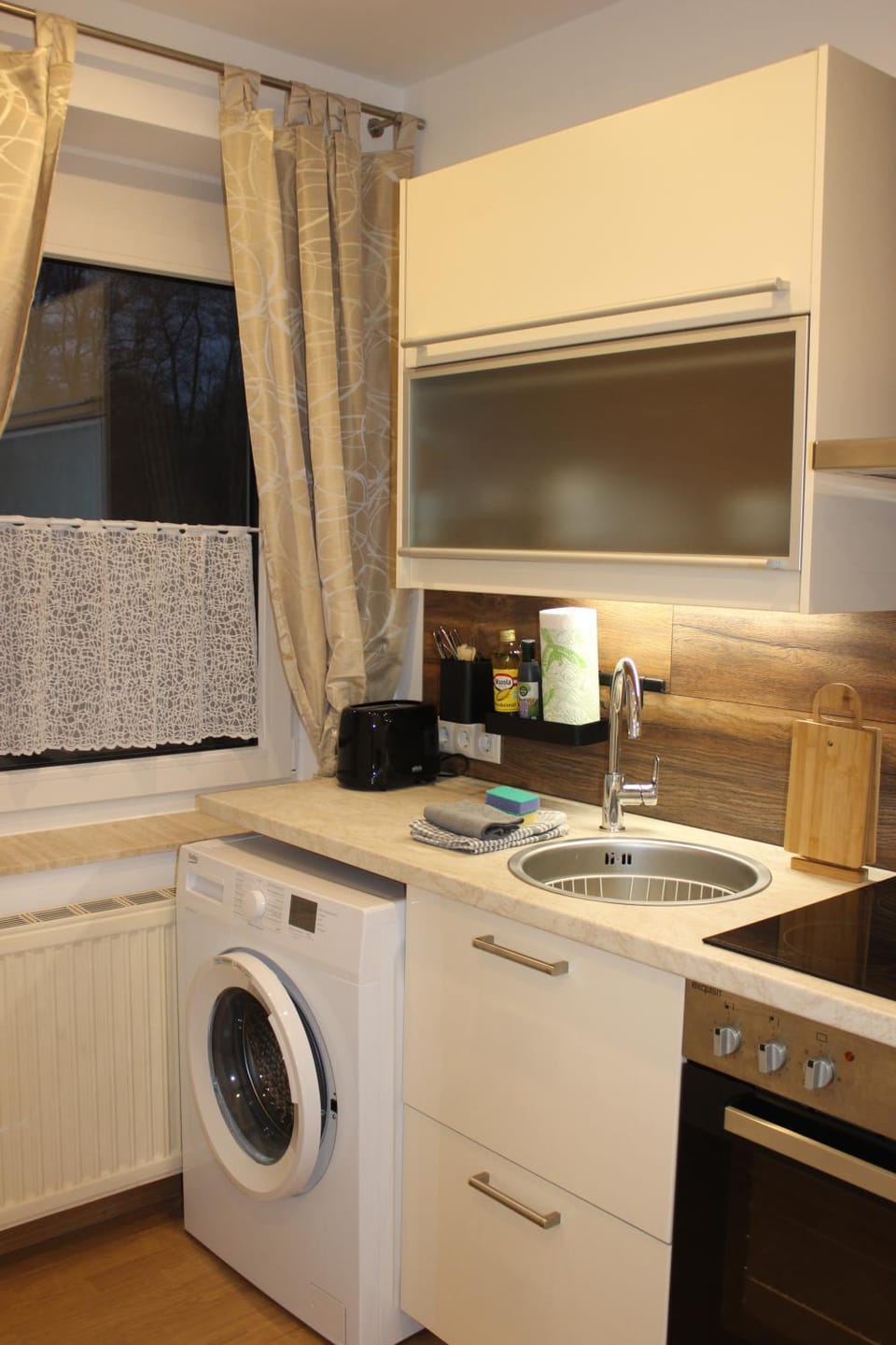 Kitchen or kitchenette, washing machine