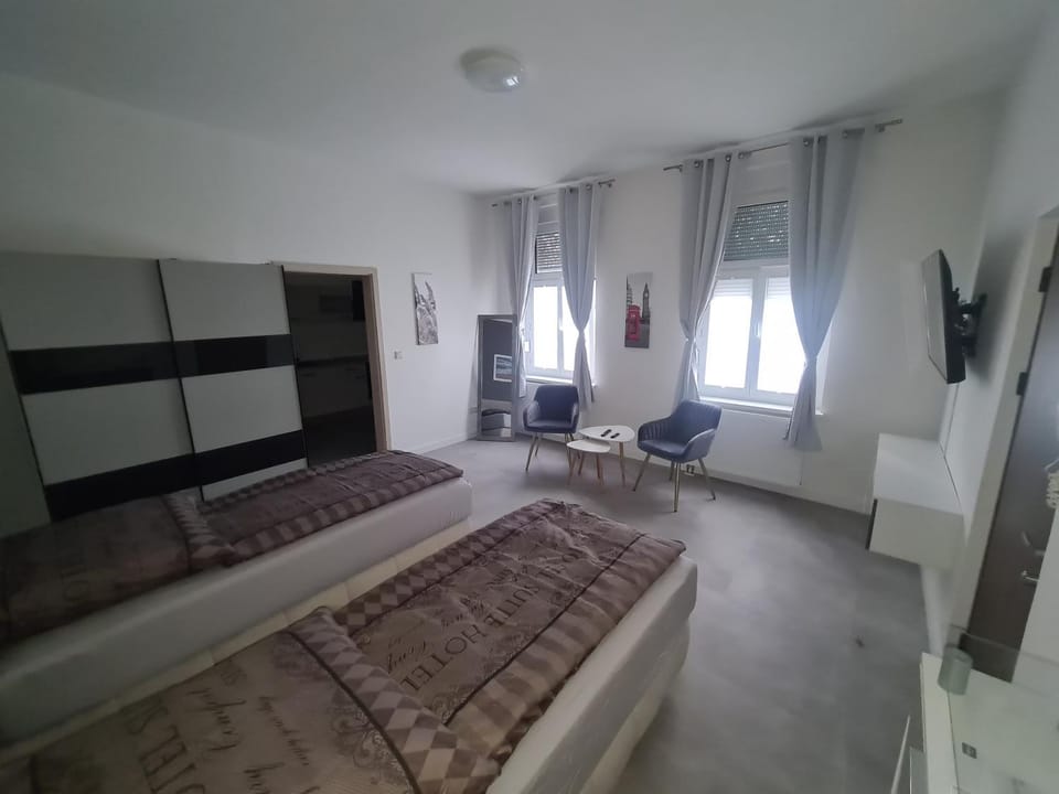 Bed, TV and multimedia, Seating area, Bedroom, hair dresser
