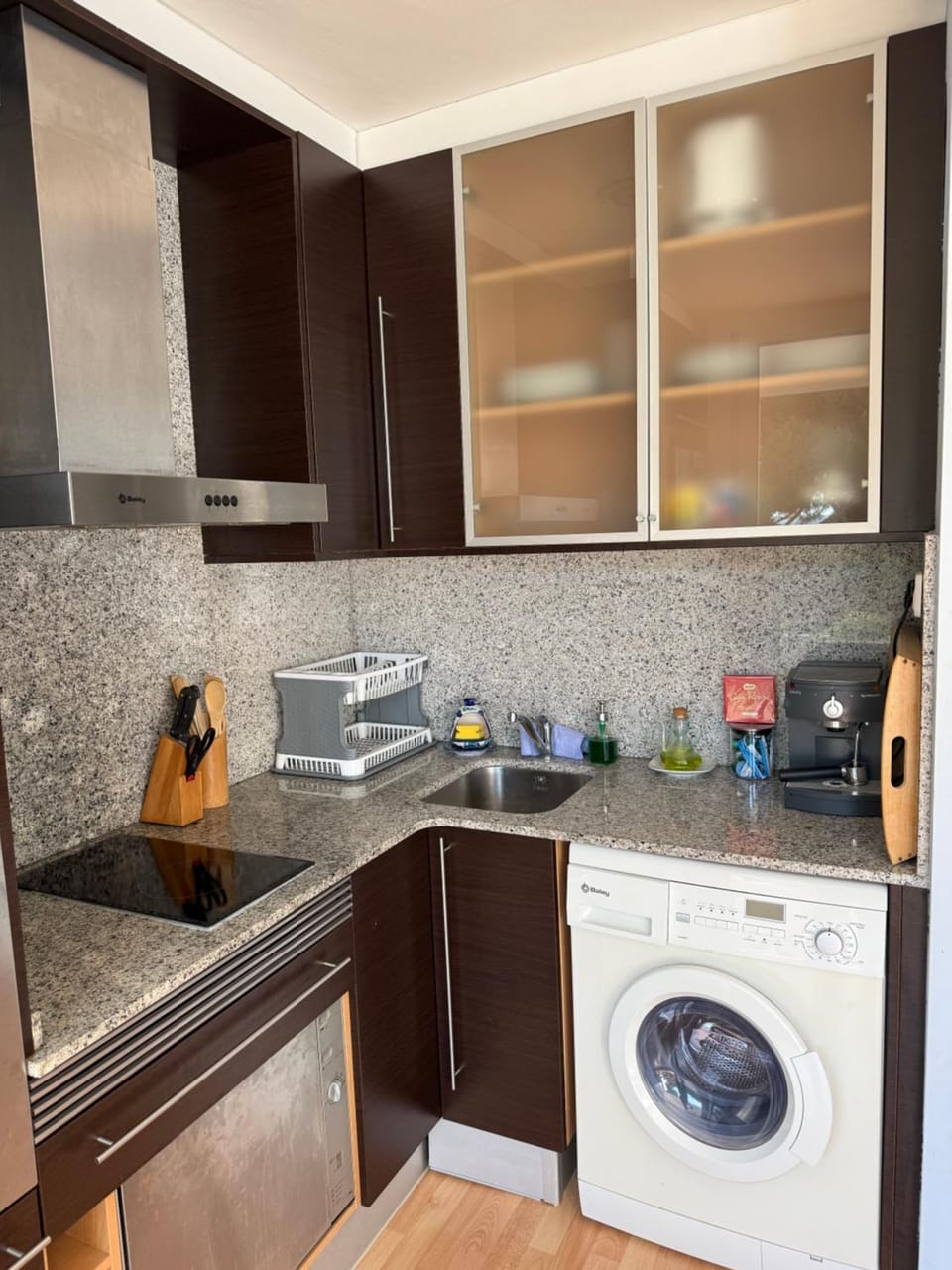 Kitchen or kitchenette, stove, washing machine, dryer