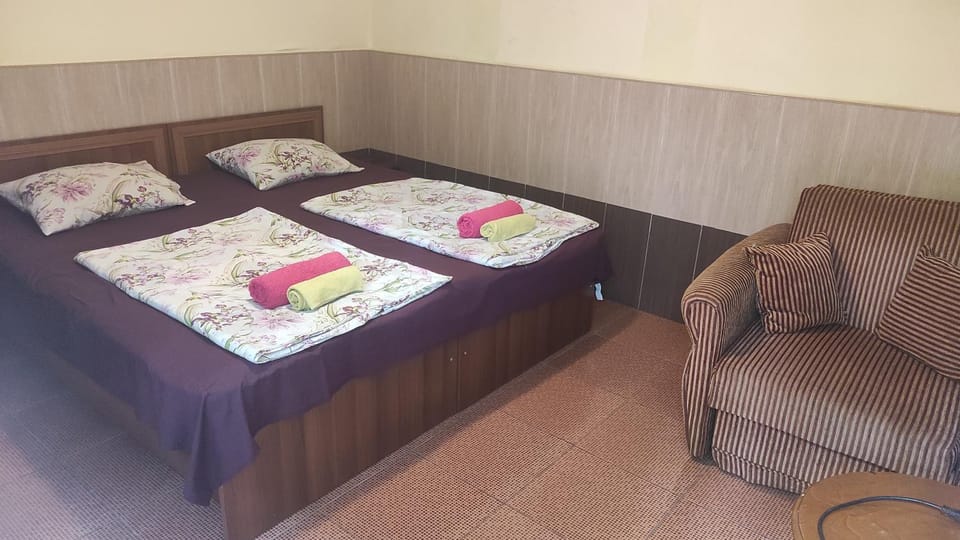 Bed, Living room, Seating area, Bedroom