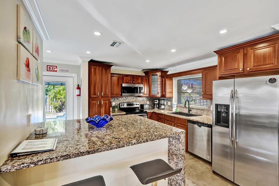 Kitchen or kitchenette, dishwasher, oven, stove, toaster