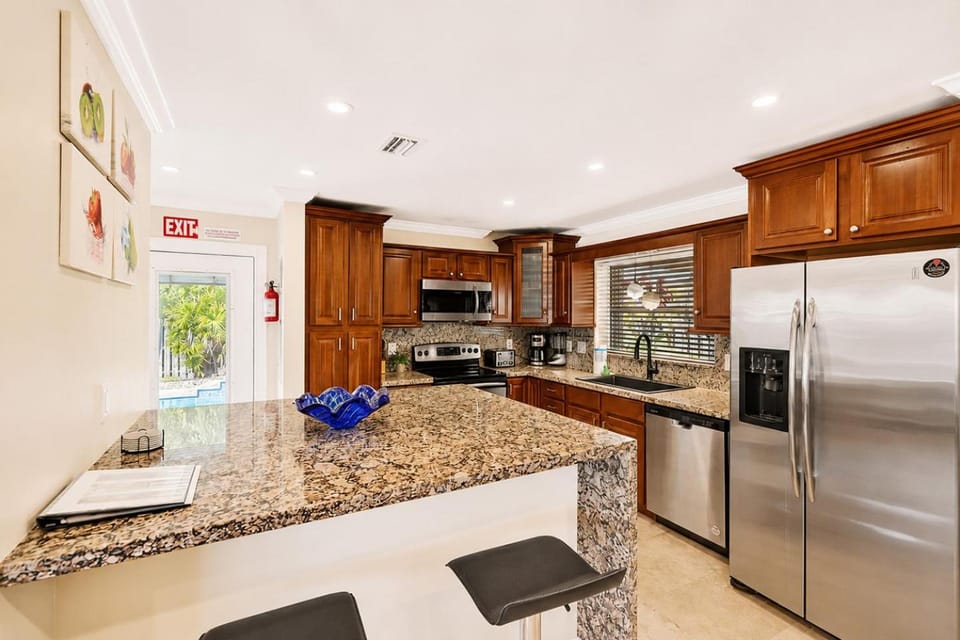 Kitchen or kitchenette, dishwasher, oven, stove, toaster