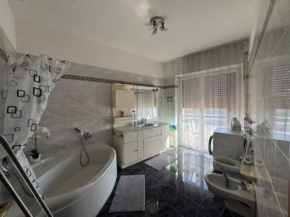 Shower, Toilet, Bathroom, Bath, hair dryier, towels, towels, laundry, washing machine
