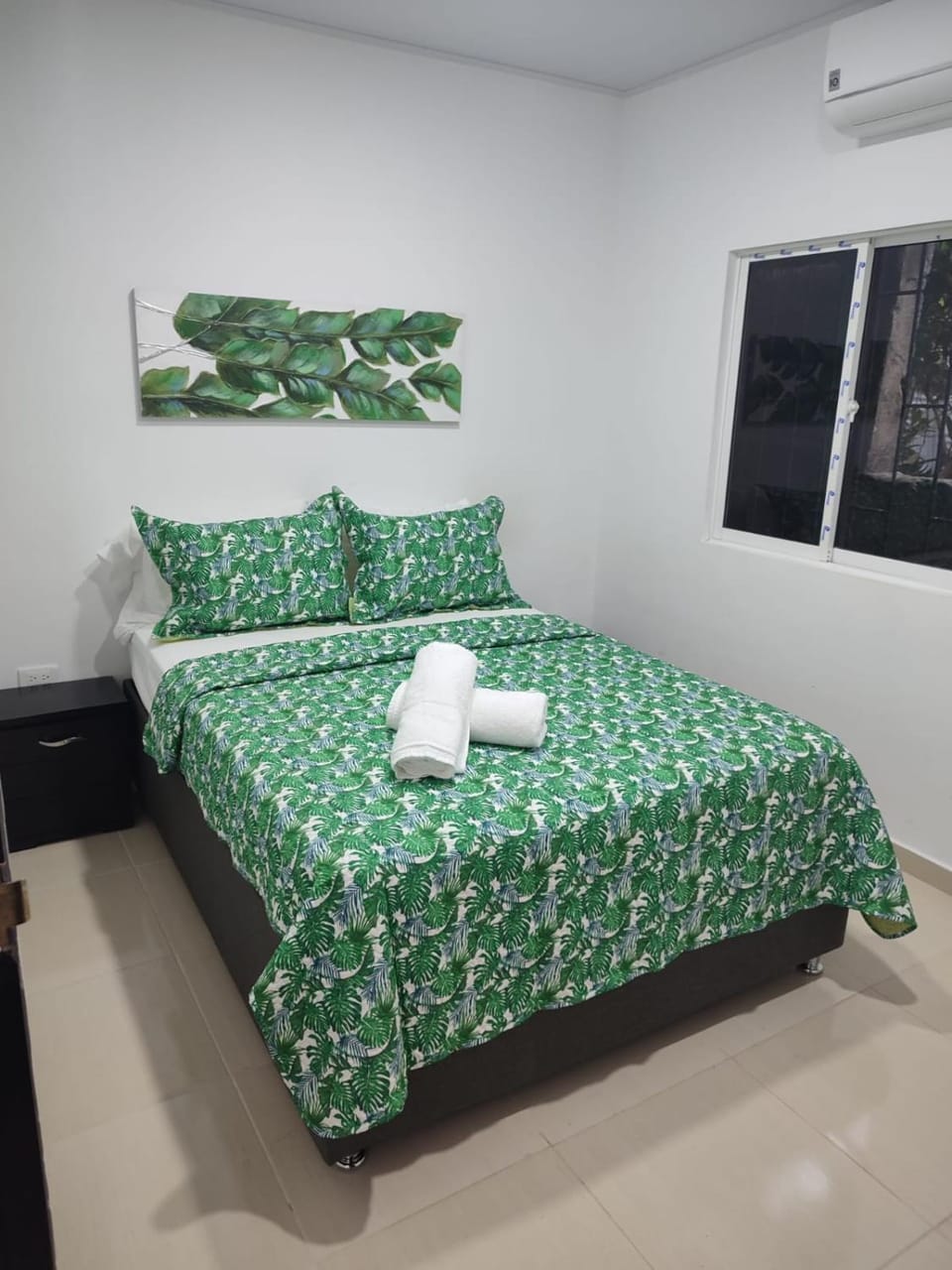 Bed, towels, air conditioner