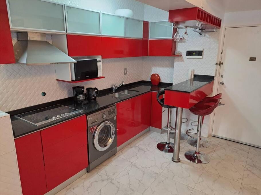 Kitchen or kitchenette, stove, washing machine
