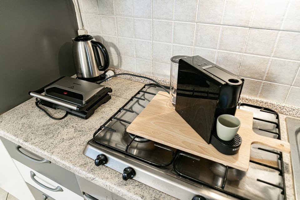 Kitchen or kitchenette, stove, toaster