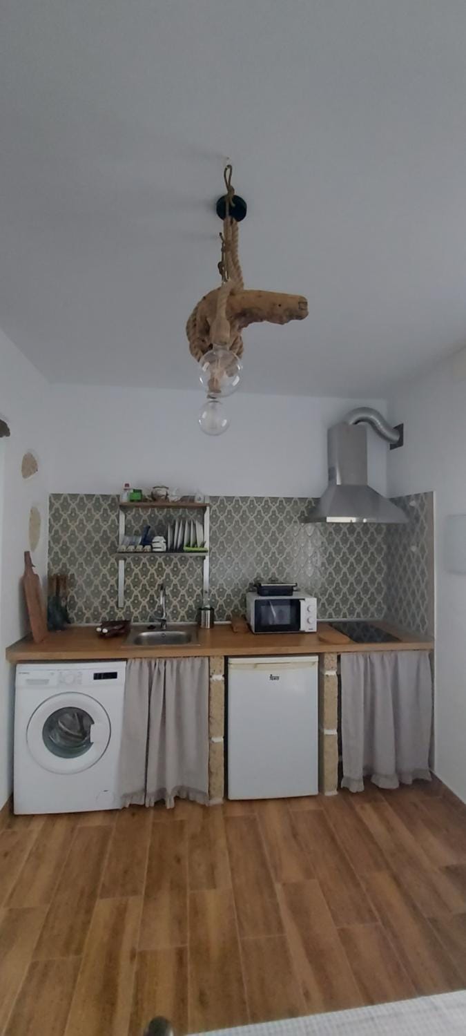 Kitchen or kitchenette, stove, washing machine