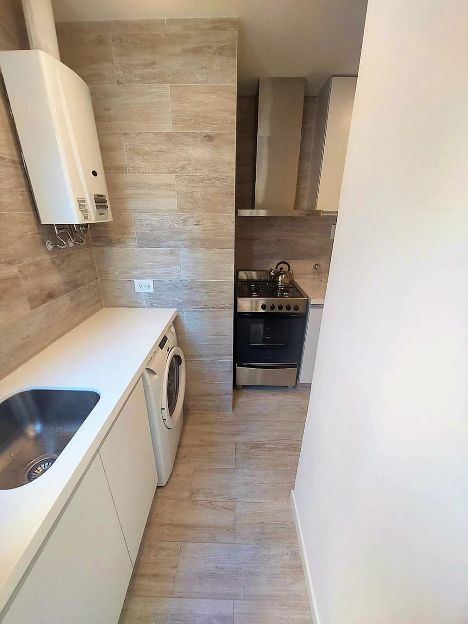 Kitchen or kitchenette, oven, stove, washing machine
