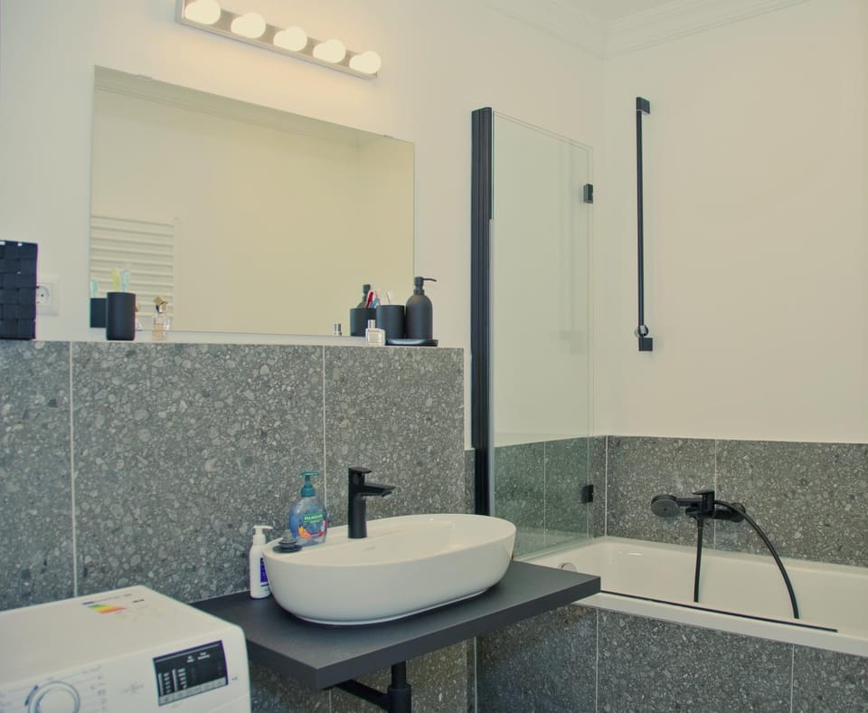 Bathroom, Bath, hair dryier, towels, washing machine