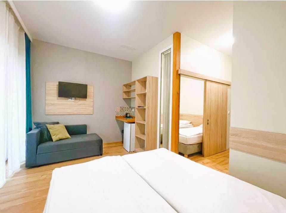 Bed, TV and multimedia, Living room, Photo of the whole room, Seating area, Bedroom, hair dresser, wardrobe
