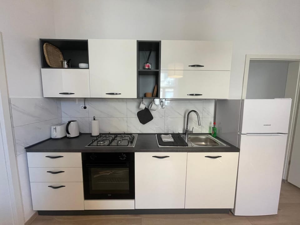 Kitchen or kitchenette, stove