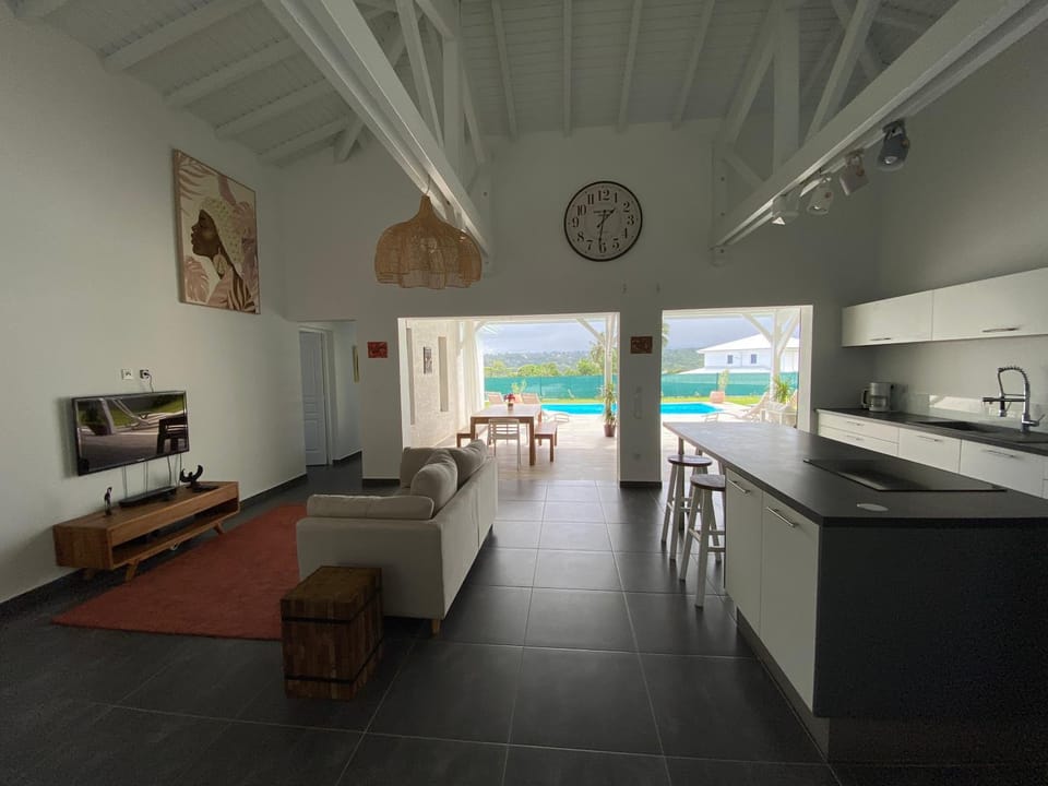 TV and multimedia, Kitchen or kitchenette, Living room, Seating area, Dining area, Pool view