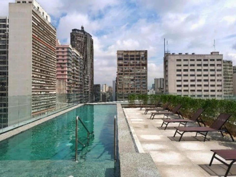 Property building, Day, Pool view, Swimming pool, Swimming pool, sunbed