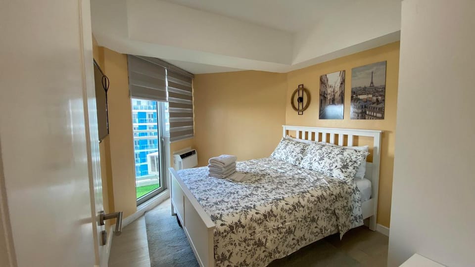 Two Bedroom with Balcony by The Bali Corner at Azure North , POOL and BEACH VIEW - unit with Bathtub Apartment in Calabarzon