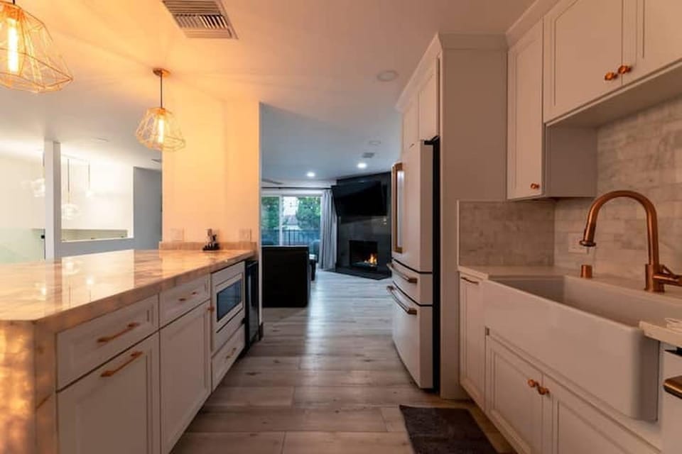 Kitchen or kitchenette, dishwasher, oven, stove