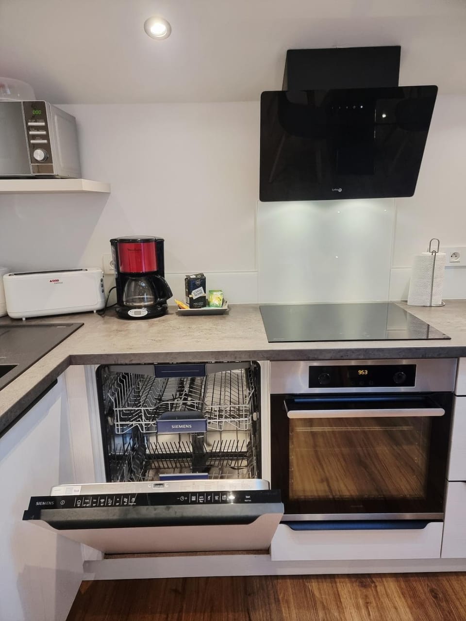 Kitchen or kitchenette, dishwasher, oven, stove
