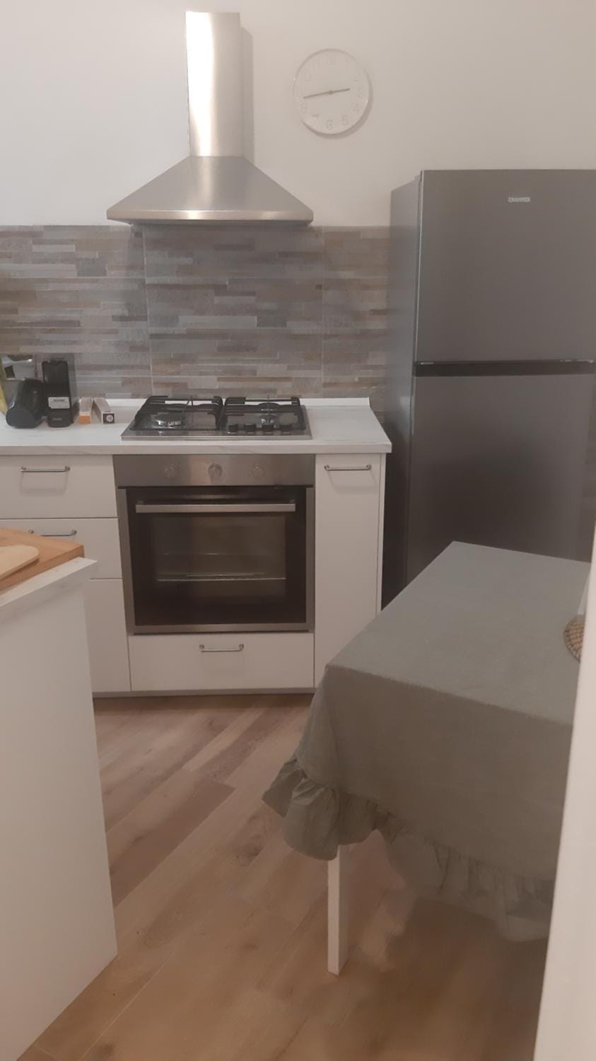 Kitchen or kitchenette, dishwasher, oven, stove
