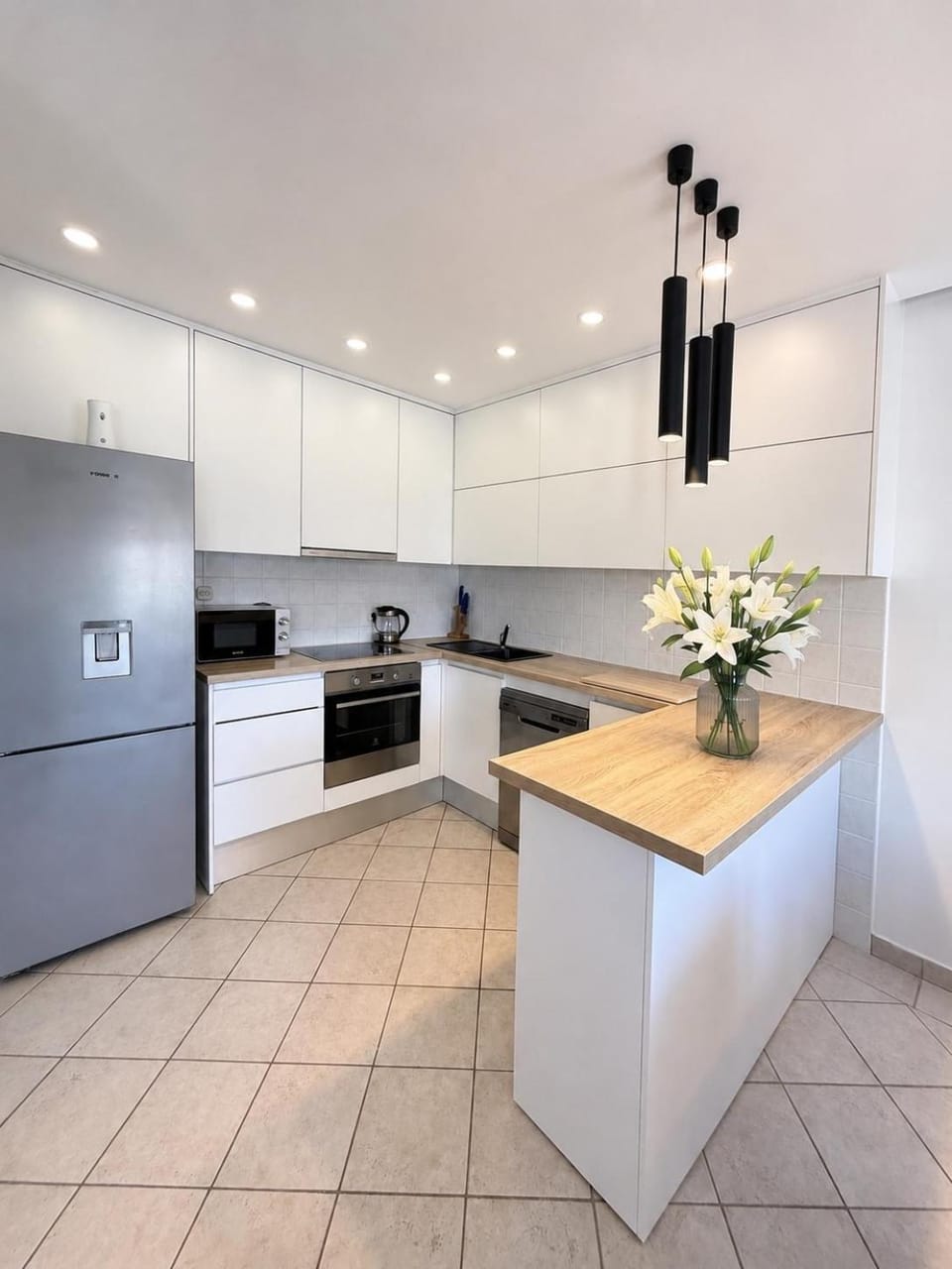 Kitchen or kitchenette, dishwasher, oven, stove