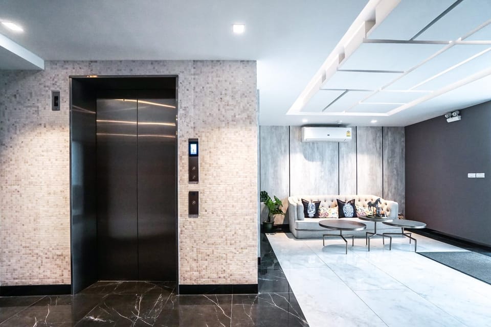 Property building, Living room, Lobby or reception, elevator