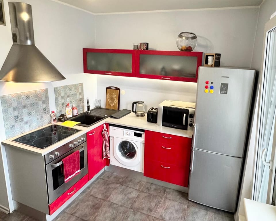 Kitchen or kitchenette, oven, stove, toaster, washing machine