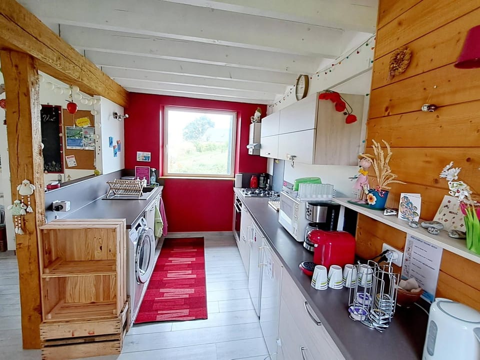 Kitchen or kitchenette, dishwasher, oven, stove, toaster, washing machine