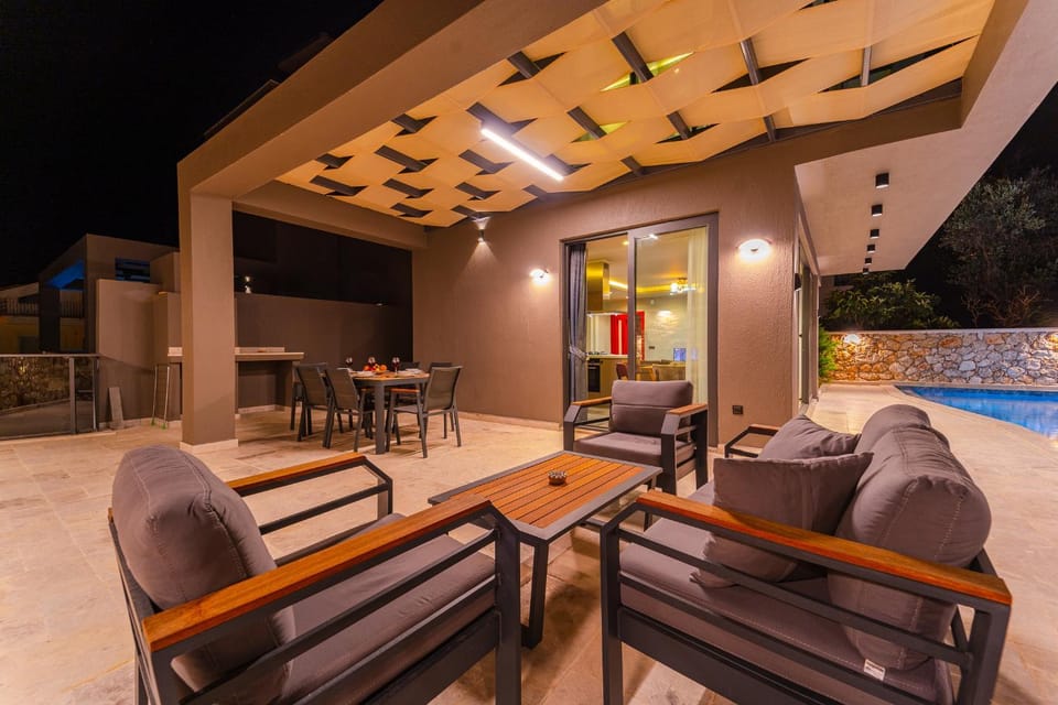 Patio, Night, Seating area, Dining area, Pool view, Swimming pool