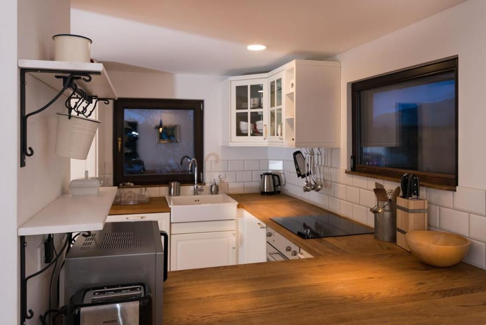 Kitchen or kitchenette, microwave, oven, stove, toaster
