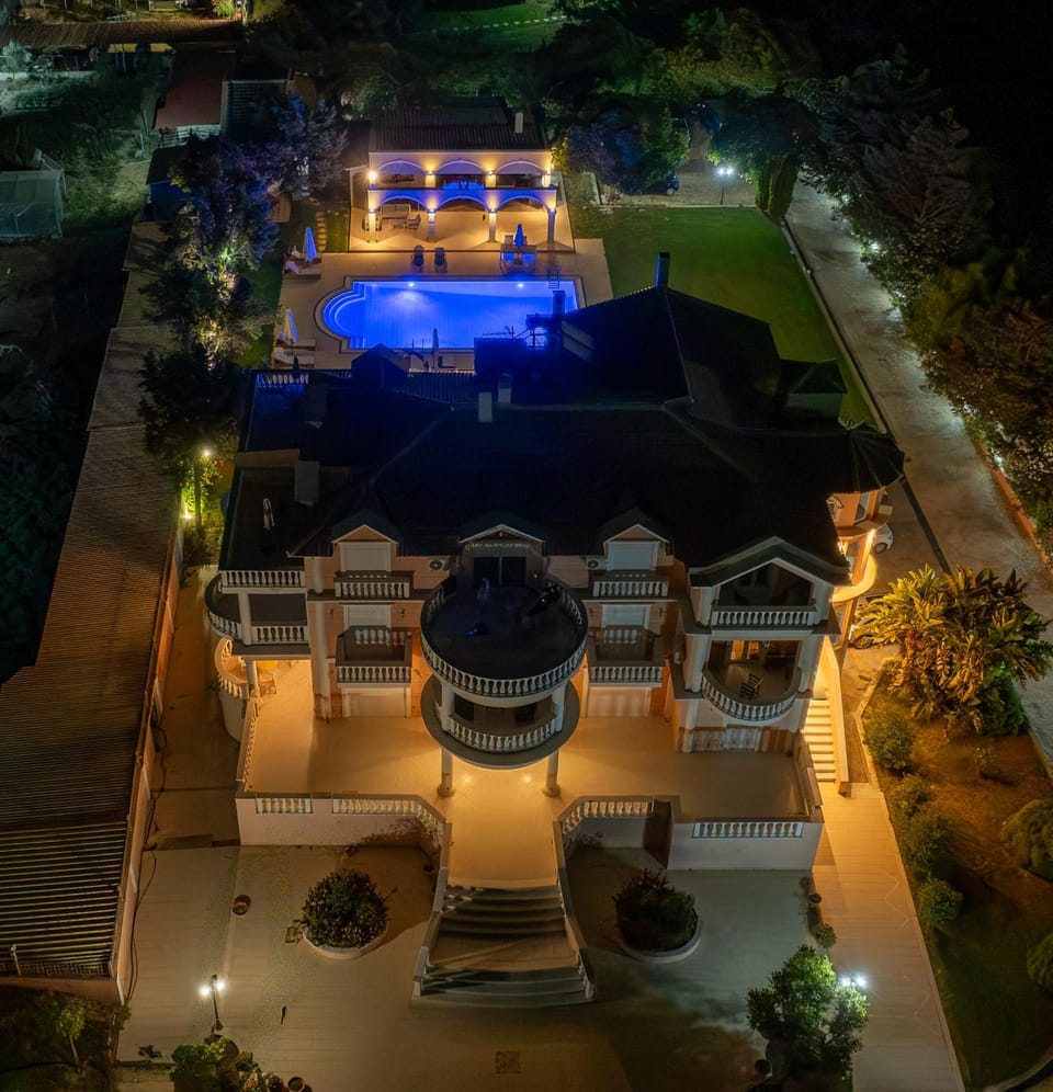 Property building, Patio, Night, Pool view, Swimming pool, sunbed