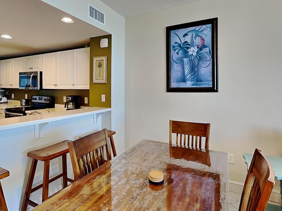 Kitchen or kitchenette, Dining area, furniture, microwave, air conditioner