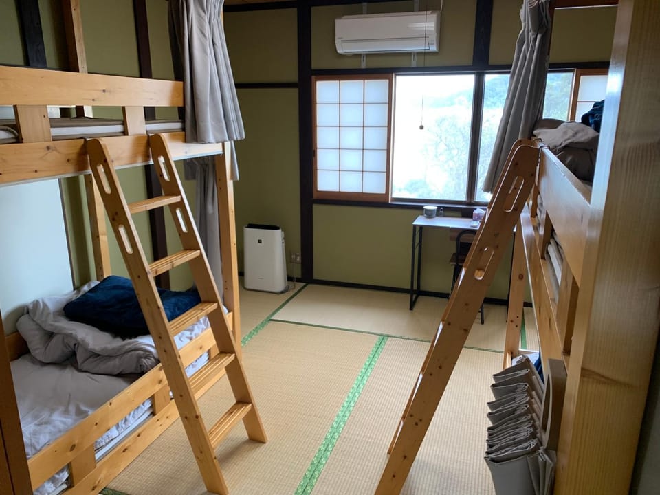Photo of the whole room, bunk bed, air conditioner