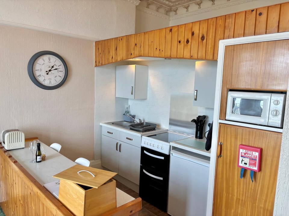 Kitchen or kitchenette, oven, stove, toaster