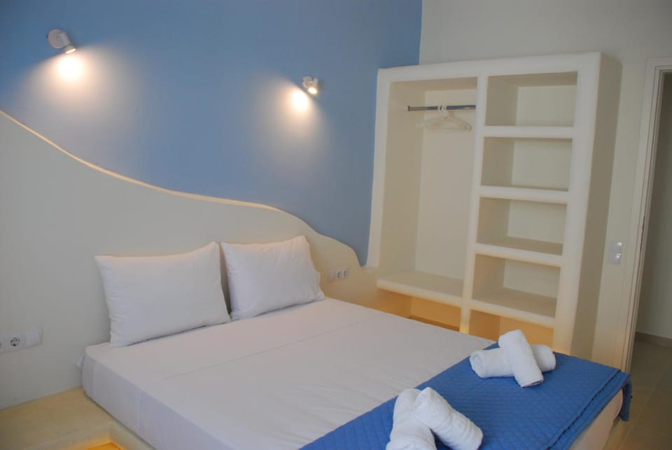 Bed, towels, wardrobe