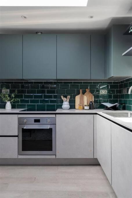 Kitchen or kitchenette, microwave, oven, stove, toaster, laundry