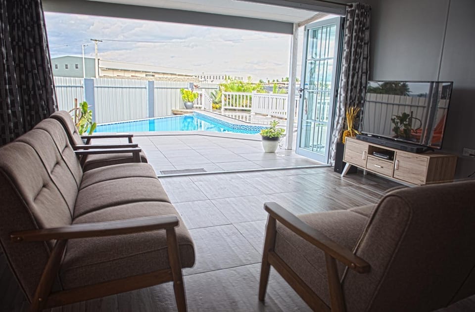 Patio, Balcony/Terrace, Living room, Seating area, Pool view, Swimming pool