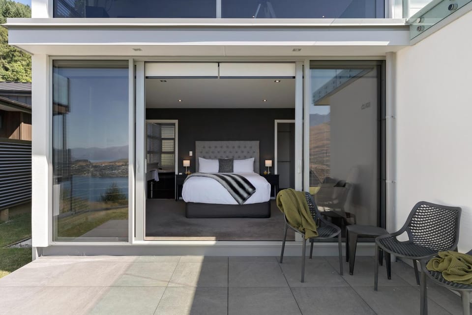 Property building, Bed, Seating area, Bedroom
