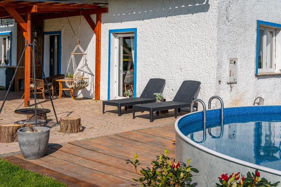 Property building, Patio, Day, Natural landscape, Summer, Living room, Pool view, sunbed