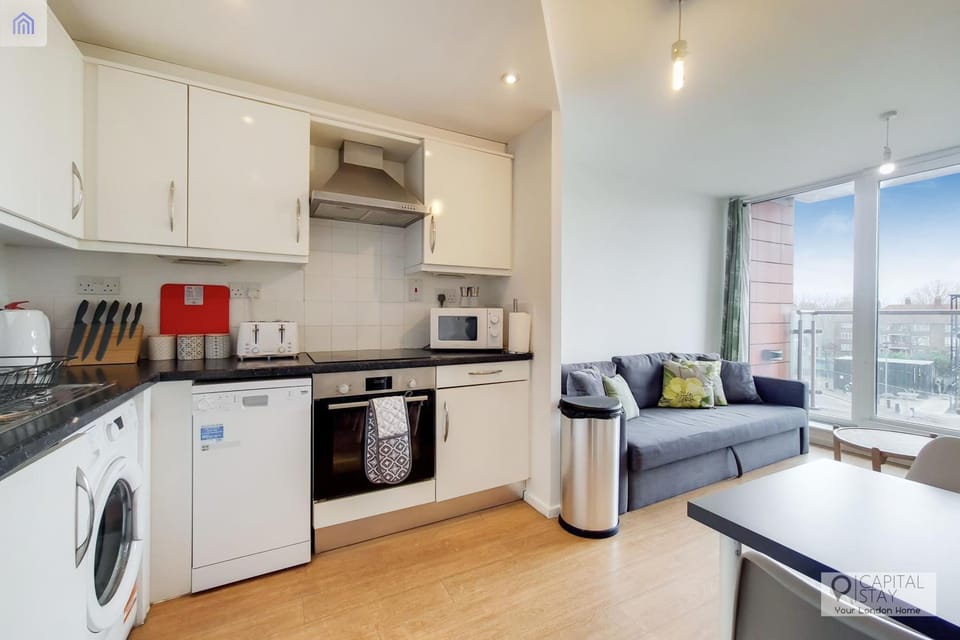 Kitchen or kitchenette, dishwasher, oven, stove