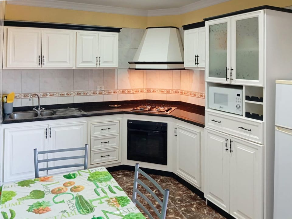 Kitchen or kitchenette, microwave, oven